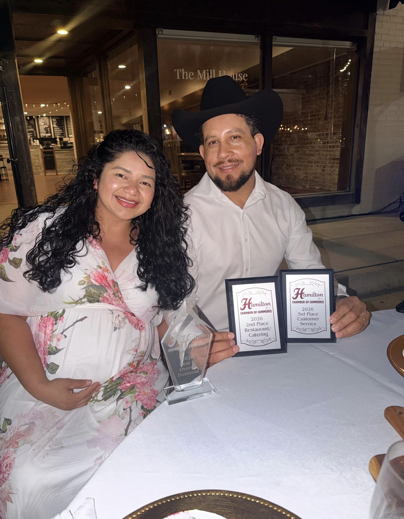 Owners of Elder's Tacos & Steaks with their Chamber of Commerce awards at a dinner event