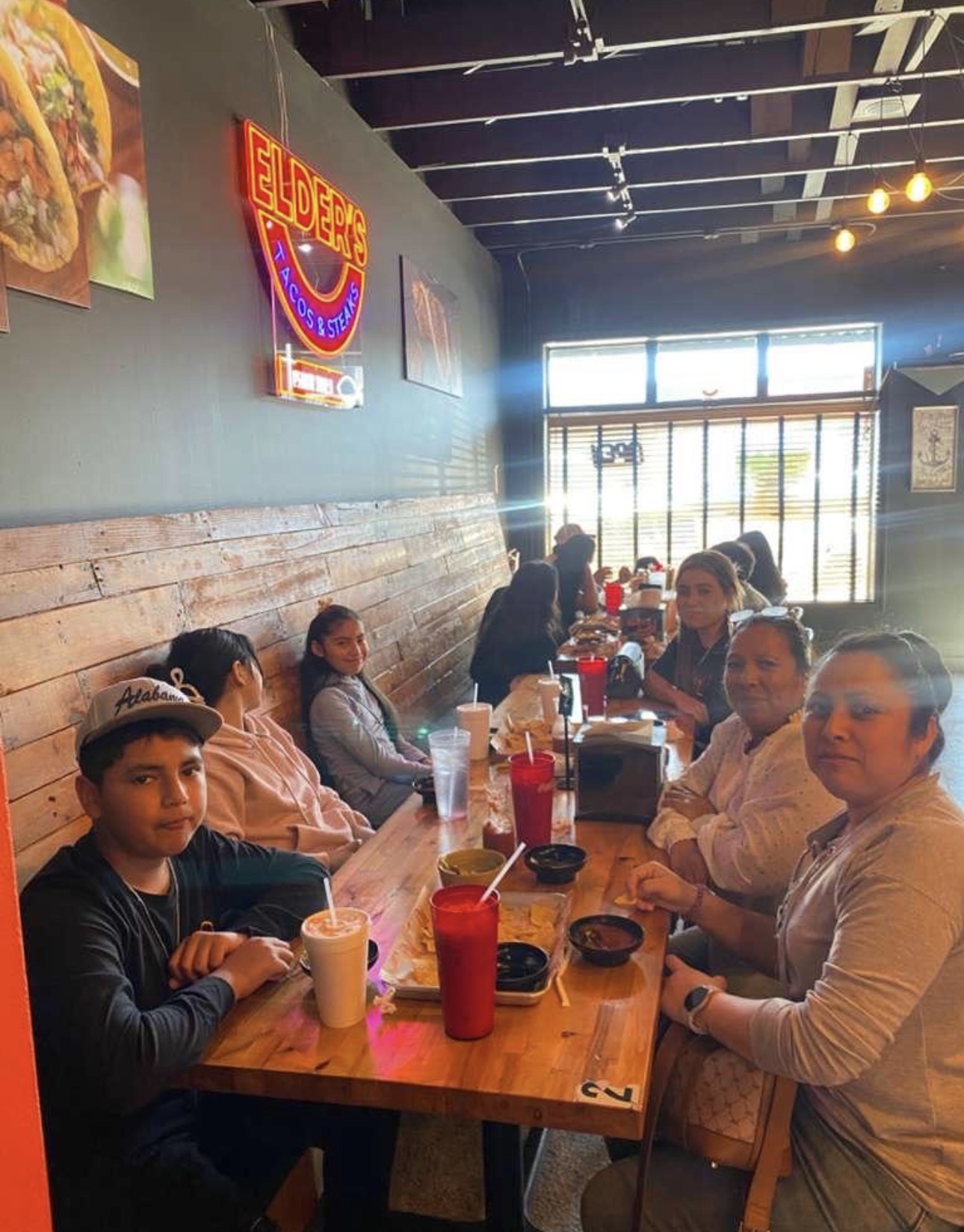 Guests enjoying tacos and drinks at Elder's Tacos & Steaks in Hamilton, Alabama